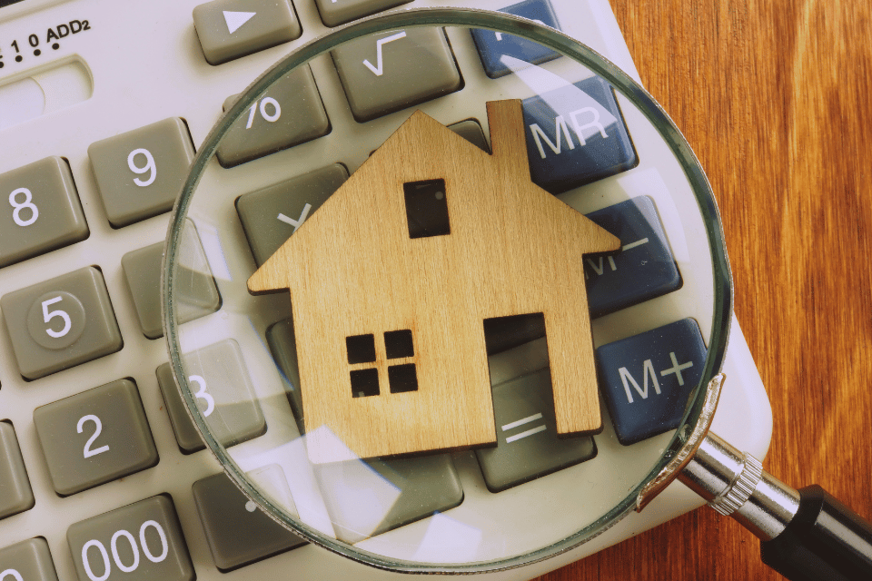 Image showing a house superimposed on a calculator