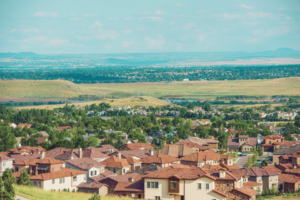 Image shows aerial view of neighborhood of houses