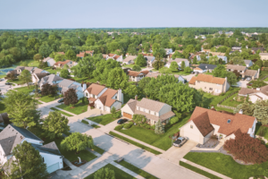 Image shows aerial view of residential neighborhood.