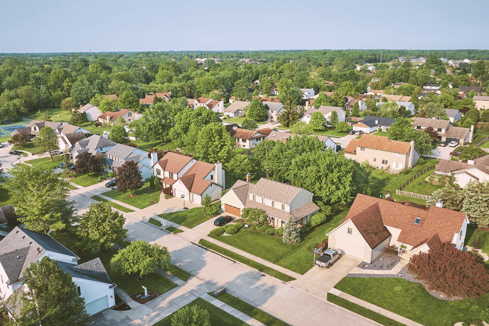 Image shows aerial view of residential neighborhood.