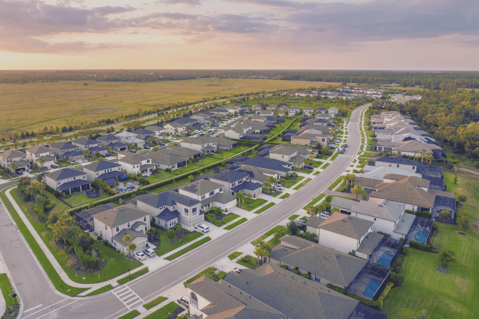 Image shows aerial view of housing development